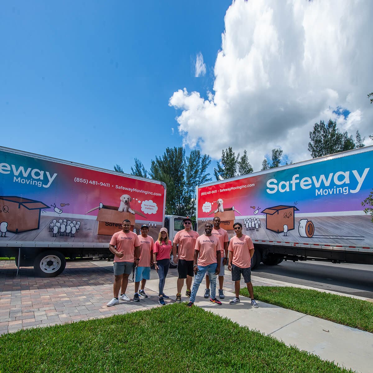 Safeway Moving crew in front of two branded trucks in South Florida